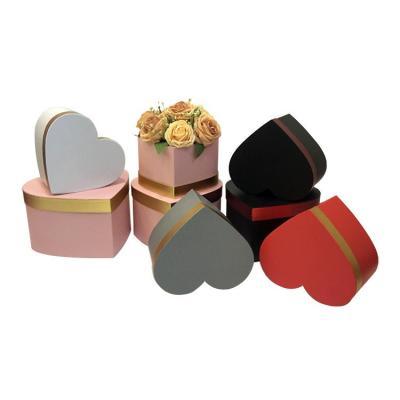 China Recycled Materials Heart Shaped Cover Three Flowers Simple Gift Birthday Present With Hand Paper Box for sale