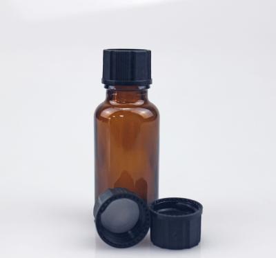 China 20ml Essential Oil Round Glass Cosmetic Amber Bottle With 18/415 Black Plastic Screw Cap for sale