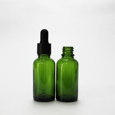 China Euro Cosmetic Green Glass Bottle For Essential Oil Glass Bottles With Non Spill 18/415 Smooth Dropper Cap for sale