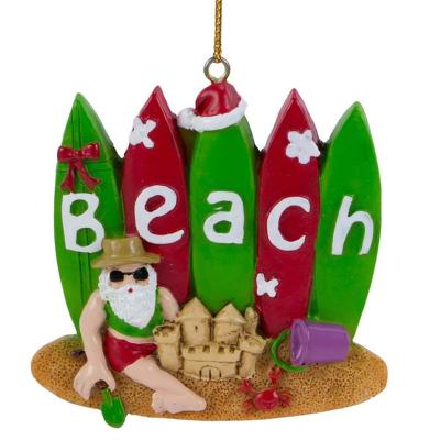 China Resin Santa from USA with surfboards and sand block on the beach ornament for sale