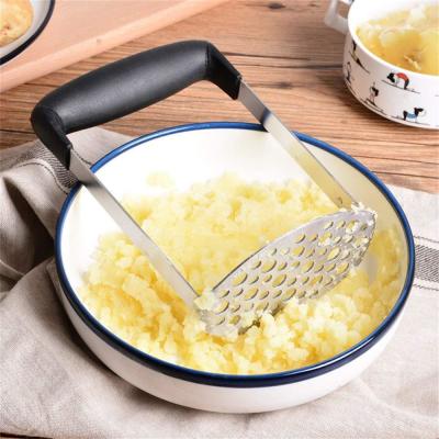 China Stainless Steel Garlic Press Manual Kitchen Gadget Mashed Potato Masher Modern for sale