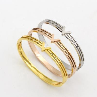 China TRENDY fashion new ladies gold stainless steel bangle branded bracelets for women with brand logo for sale