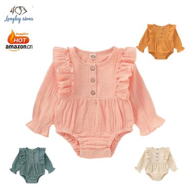 China Cute Cozy Wholesale Organic Solid Long Sleeves Ruffles Newborn Infant Overalls Clothes 100% Cotton Fabric Baby Romper for sale