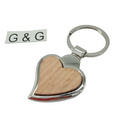 China Custom Engraved Wood Decoration Key Tag Blank Metal Heart Shaped Key Chain for sale