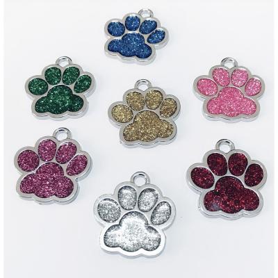 China Durable Durable In Stock Pet ID Tags Paws Shaped Dog Tags Laser Pendant Logo for sale