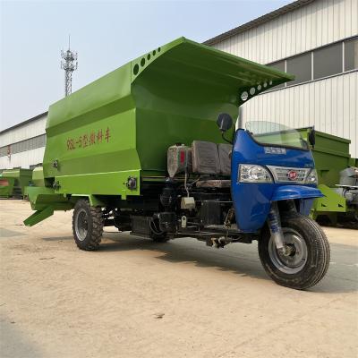 China Cultivate Full Automatic Farm Tricycle Feed Spreader Electric Cattle and Sheep Spreader Mixing Driver for sale