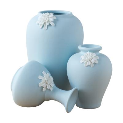 China Modern Nordic handmade ceramic wholesale white creative home decoration gift cookie ornaments small central institute of statistics vase for sale