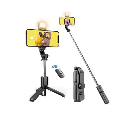 China Folding Mini Portable Customization Tripod 3 in 1 360 Degree Mini Fill Light Handheld Telescopic Selfie Stick Selfie Stick for sale