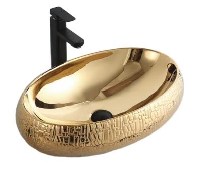 China Modern China Manufacturer Gold Color Bathroom Sink Hotel Ceramic Wash Basin for sale