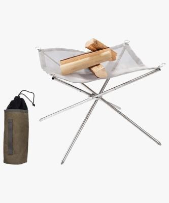 China Portable Fireplace Outdoor Camping Barbecue Rising Grill With Stand Stainless Steel Portable Folding Fire Net for sale