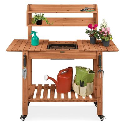 China Wholesale Pastoral Outdoor Garden Sink Workstation Table Fir Wood Potting Bench With 4 Locking Wheel for sale