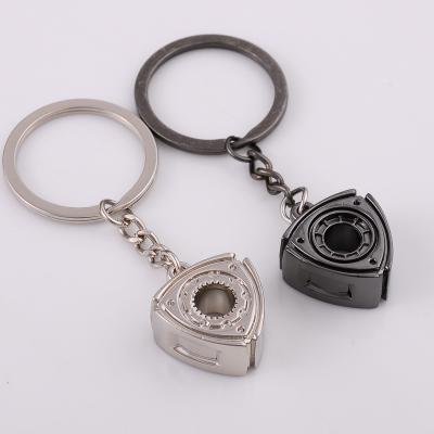 China Durable Creative Metal Key Ring Pendant Car Modification Rotary Key Trend New Key Chain for sale