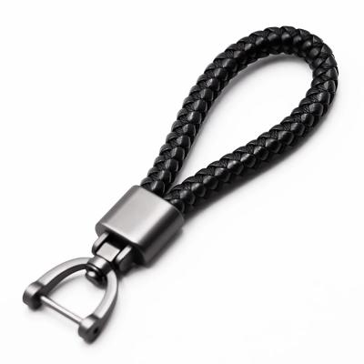 China Promotional Gifts Hand - Woven Leather 360 Degree Rotating Buckle Horseshoe Car Key Chain for sale