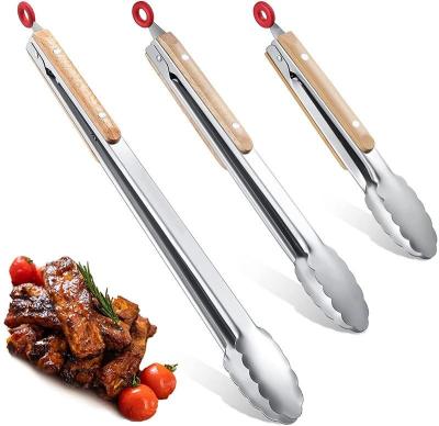 China Easily Cleaned Metal Tongs Stainless Steel BBQ Grill Tongs With Oak Wood Handle Cooking Kitchen Tongs Locking Food For Grilling for sale