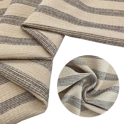 China New anti-static hot sale black 100% polyester stripe crepe fabric black warp knitted fashion beige fabric for dress for sale