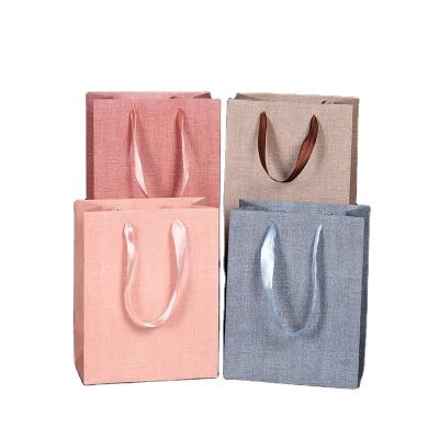 China TPak Handmade High Quality Custom Printed Plain Gray Paper Carry Bags Delivery Paper Bags for sale