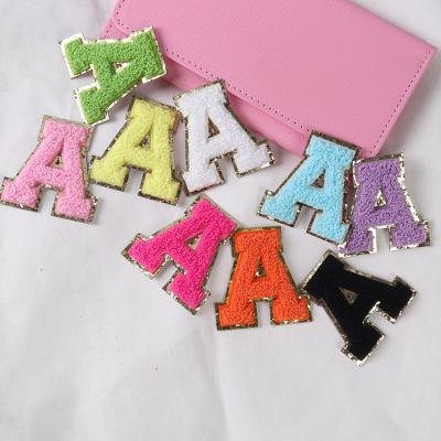 China Viable hot sale money bag embossed pink embroidery patches colorful gold glitter fac chenille towel embroidered letter stickers for sale