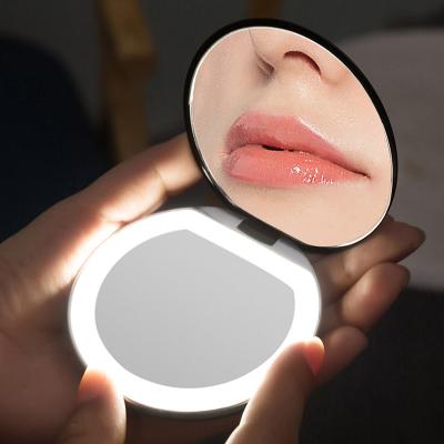 China Custom Portable Makeup Mirror LED Lighted Round Folding Magnifying Travel Beauty Ring Photo Fill Light Small Cosmetic Mirrors for sale