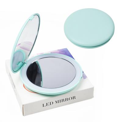 China Personalized HD Magnifying Lighted Makeup Mirror 5 Colors Light Up Mini Round Portable LED Make Up Mirror Feeling Foldable Makeup Mirror for sale