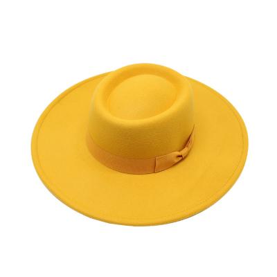 China 2021Foreign image trade new big image trade winter polyester 9.5cm jazz men's and women's solid color fashion concave top felt hat for sale