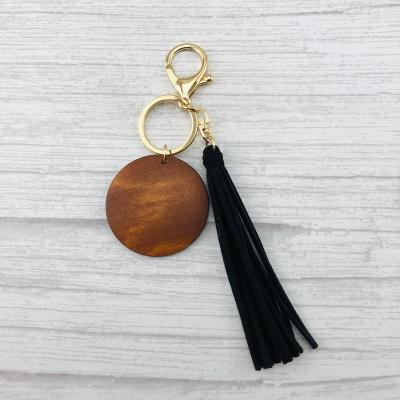 China Available Cotton 12 Colors Suede Tassel White Wood Engraved Disc Key Chain for sale