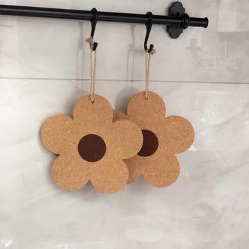 China Beautiful Sustainable Hanging Flower Shaped Cork Kitchen Insulated Absorbent Coasters for sale