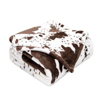 China Custom plain plain knitted fluzzy warm 100% polyester cow printed brushed fleece flannel blanket for home for sale