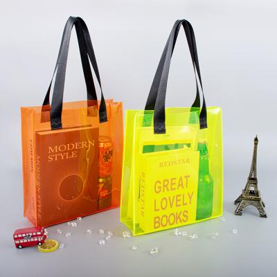 China Fashion ; Who respects the environment; Clear Waterproof PVC Tote Bag With Logo Print Shopping Bag Waterproof Custom Colorful Transparent Gift Bag for sale