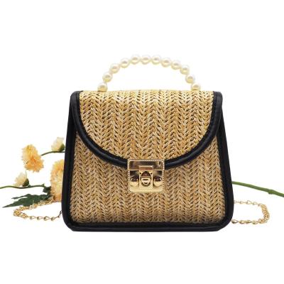 China Retro Pastoral Style Woven Bag Straw Woven Fashion Summer Girl's Portable Bag Messenger Bag for sale