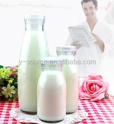 China Mini Milk Juice Bottle Wholesale Bottles Glass Milk Bottles With Metal Lids for sale