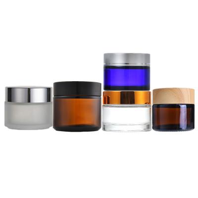 China 5ml 10ml 20ml 30ml 50ml 60ml 80ml 100ml Skin Care Cream Clear Cosmetic Glass Jar With Lid 100ml Silver Luxury Cosmetics Jar Glass Container for sale