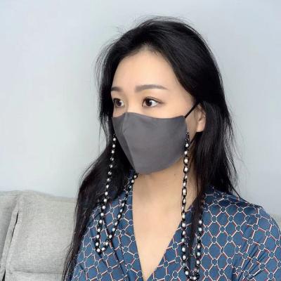 China Autumn Winter Gray Color Silk Facemask 2021 Washable Business Elegant Washable Party Face Mask With Black Pearl Chain for sale