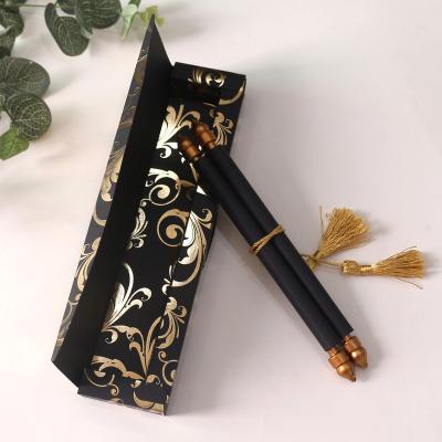 China Unique Black Europe Scroll Invitation Card With Gold Foiling Plastic Sticks And Tassel For Wedding for sale