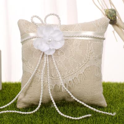 China 6 Inch Romantic Unique Wedding Ring Pillow Cushion Bearer for Beach Wedding Lace Ring Holder Canvas Wedding with White Flower for sale