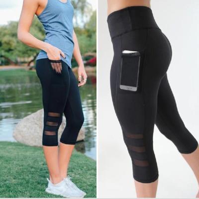 China Anti-Static Mesh Workout Yoga Leggings Women Capri Yoga Pants With Phone Pocket for sale