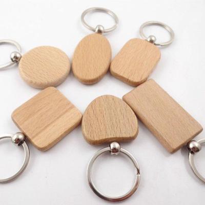 China Souvenir Gifts Promotion Mute Key Chain Engrave Print Logo Wood Key Chains Key Ring Key Chain Custom Logo for DIY Gift for sale