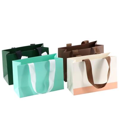 China ROMI High Quality Brown Custom Recyclable Gift Bags With Your Own Logo Kraft Paper Shopping Bags for sale