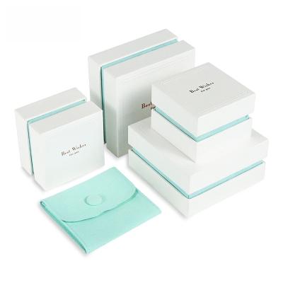 China ROMI Hot Sales Paper White Elegant Luxury Packaging Blue Jewelry Box Ring Box Jewelry Bag Pocket Unique Gift Box for sale