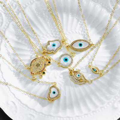 China Fashion OUKE Designs Fashion Devil Eye Multi Pendant Necklace Copper Gold Plated Exquisite Zircon Blue Evil Eye Pendants For Necklace for sale