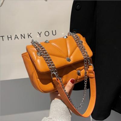 China Hot Selling Fashion Rivets Shoulder Bag Luxury Designer Fashion Rivets Handbags For Women New Small Purses for sale