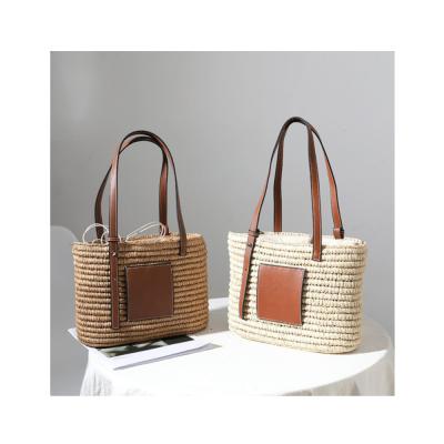 China Fashion 2021 Summer Handmade Large Rattan Bucket Purse Beach Travel Woven Straw Strap Handbag For Women for sale