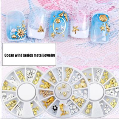 China Art Decoration New Nail Art Accessories 3D Hollow Metal Gold and Seahorse Starfish Nail Decoration Silver Rivet for sale