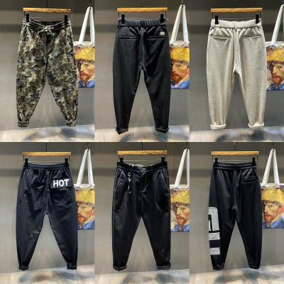 China Anti-Wrinkle In Drawstring Running Male Jogger Pants Workwear Multi-pocket Trousers Woven Fabric Trousers Man Casual Cargo Pants for sale