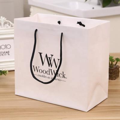 China Custom Recyclable Professional Custom Recyclable White Gift Bag Gifts White Letter Logo Pattern Shopping Paper Bag for sale