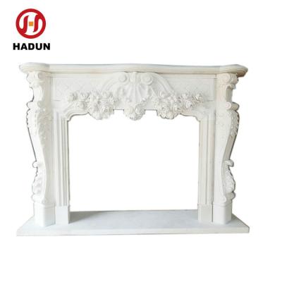 China Different styles available pure white marble flower carving mental electric fireplace on sale for sale