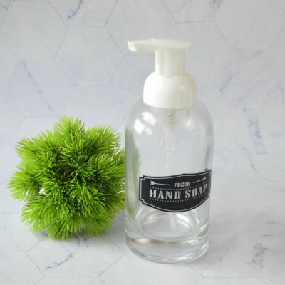 China Personal Care Wholesale Frosted Empty 40mm Wide Mouth Glass Bottles With Plastic Pump for sale