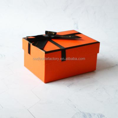 China Handmade Custom Luxury ORANGE Packaging Paper Box Lid And Base Square With Ribbon for sale