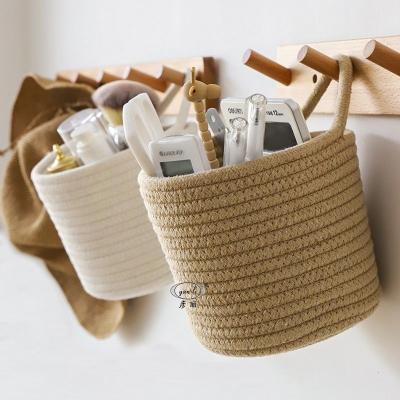 China Folding Hanging Woven Hanging Basket Wall Cotton Rope Storage Bag Shelf Bins Open Storage Basket Small for sale