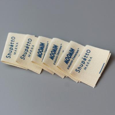 China Sustainable Custom Natural Cotton Canvas Folded Label For Kids Clothing Cotton Fabric Labels for sale