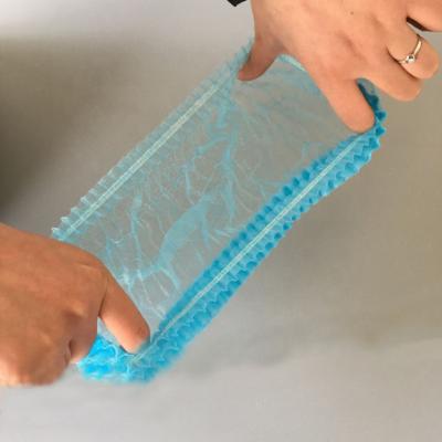 China 15mic Disposable Plastic Hotel PE Shower Cap Non Toxic OEM Elastic Band for sale